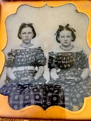 Ambrotypes. Sisters early 1850's. Note the fabulous matching dresses and tinted cheeks. Love these girls.